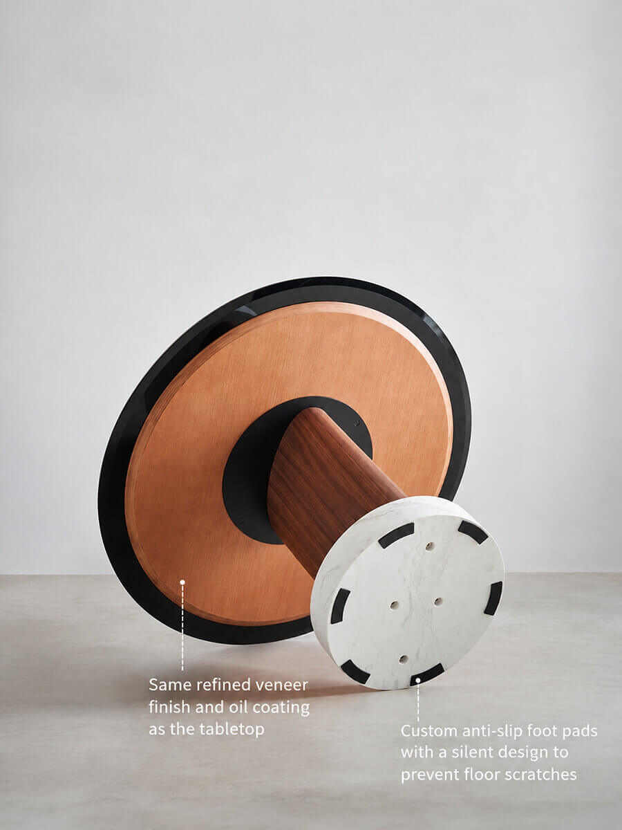 Aalto dining table underside with walnut veneer pedestal, marble base and anti-slip foot pads