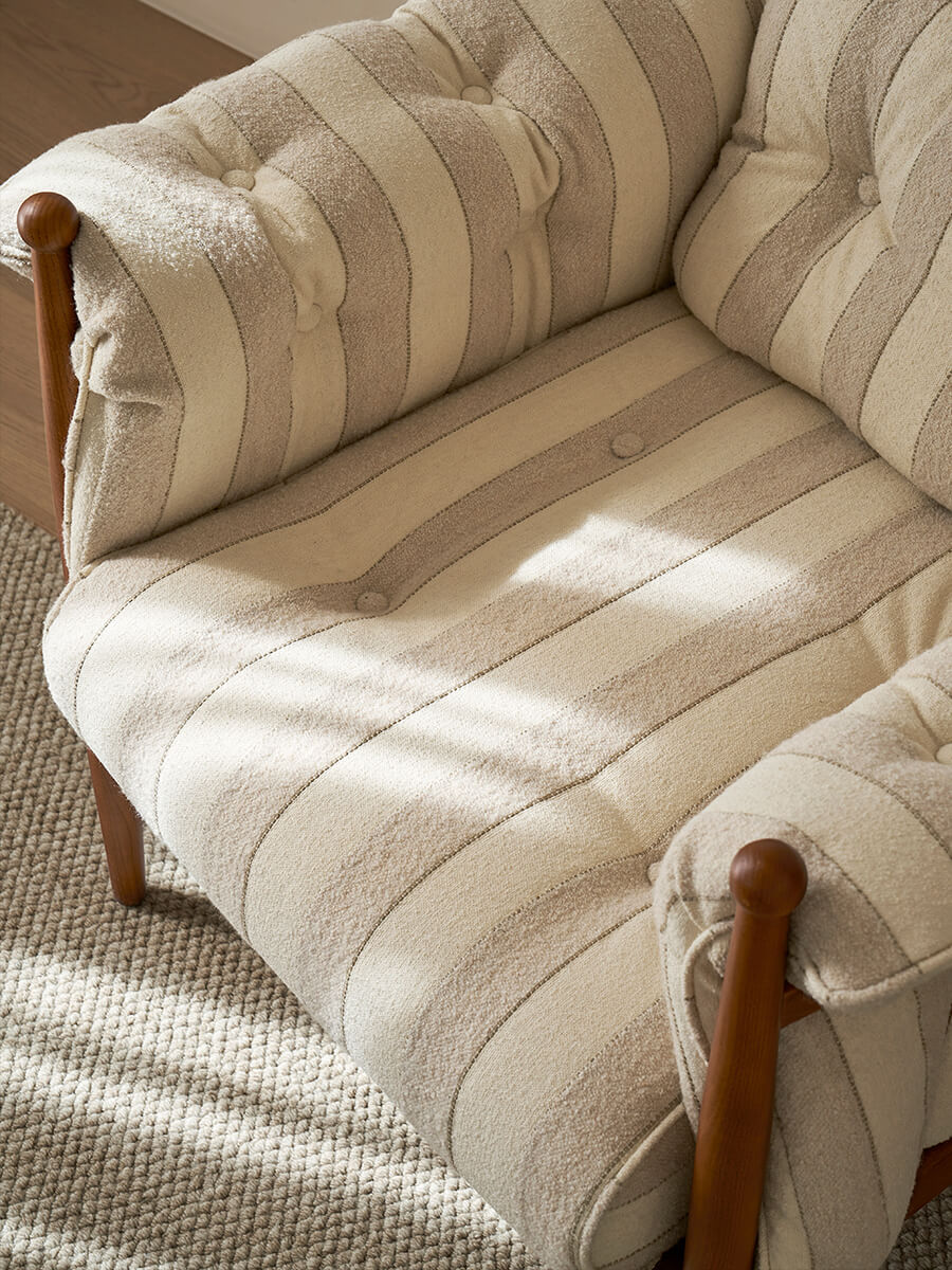 Striped fabric upholstery detail on Allan Armchair