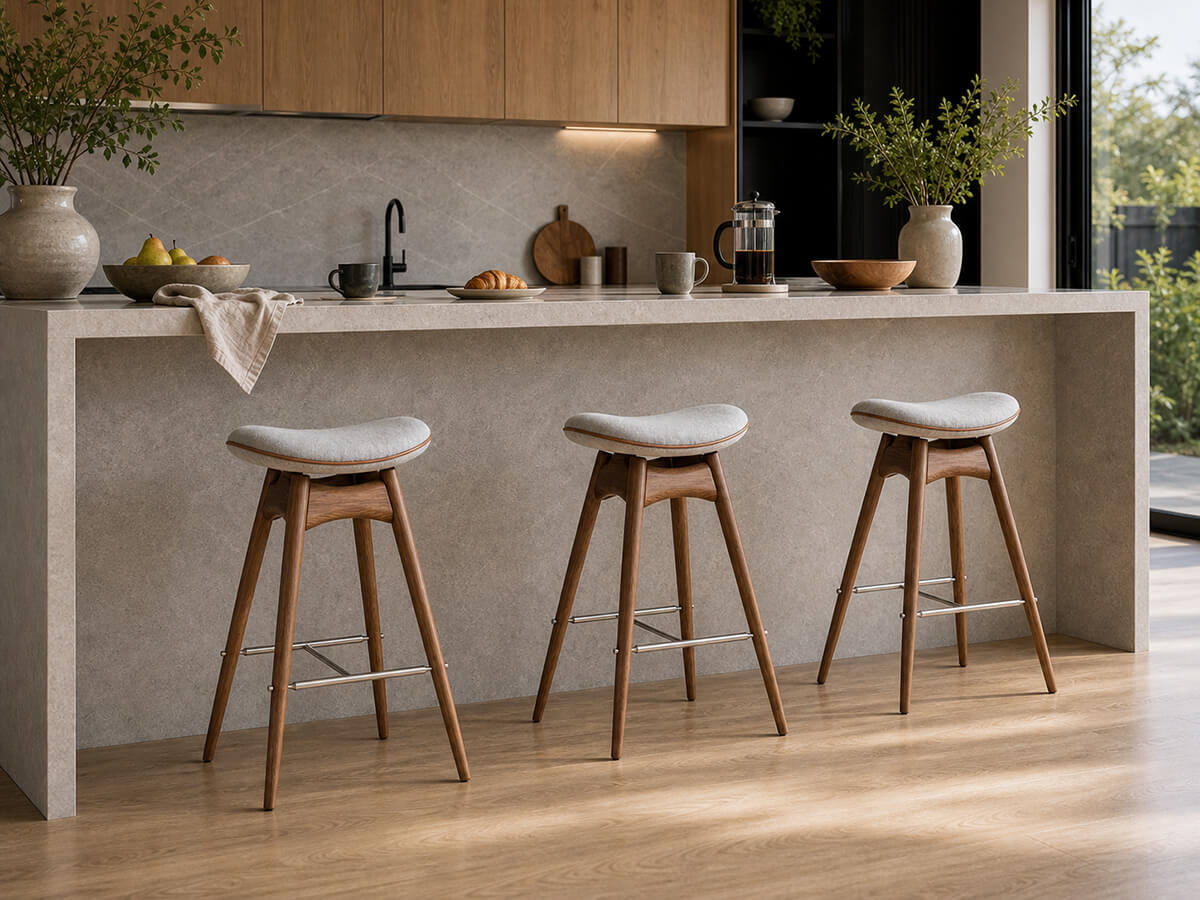 Andy solid ash bar stools arranged along a kitchen island
