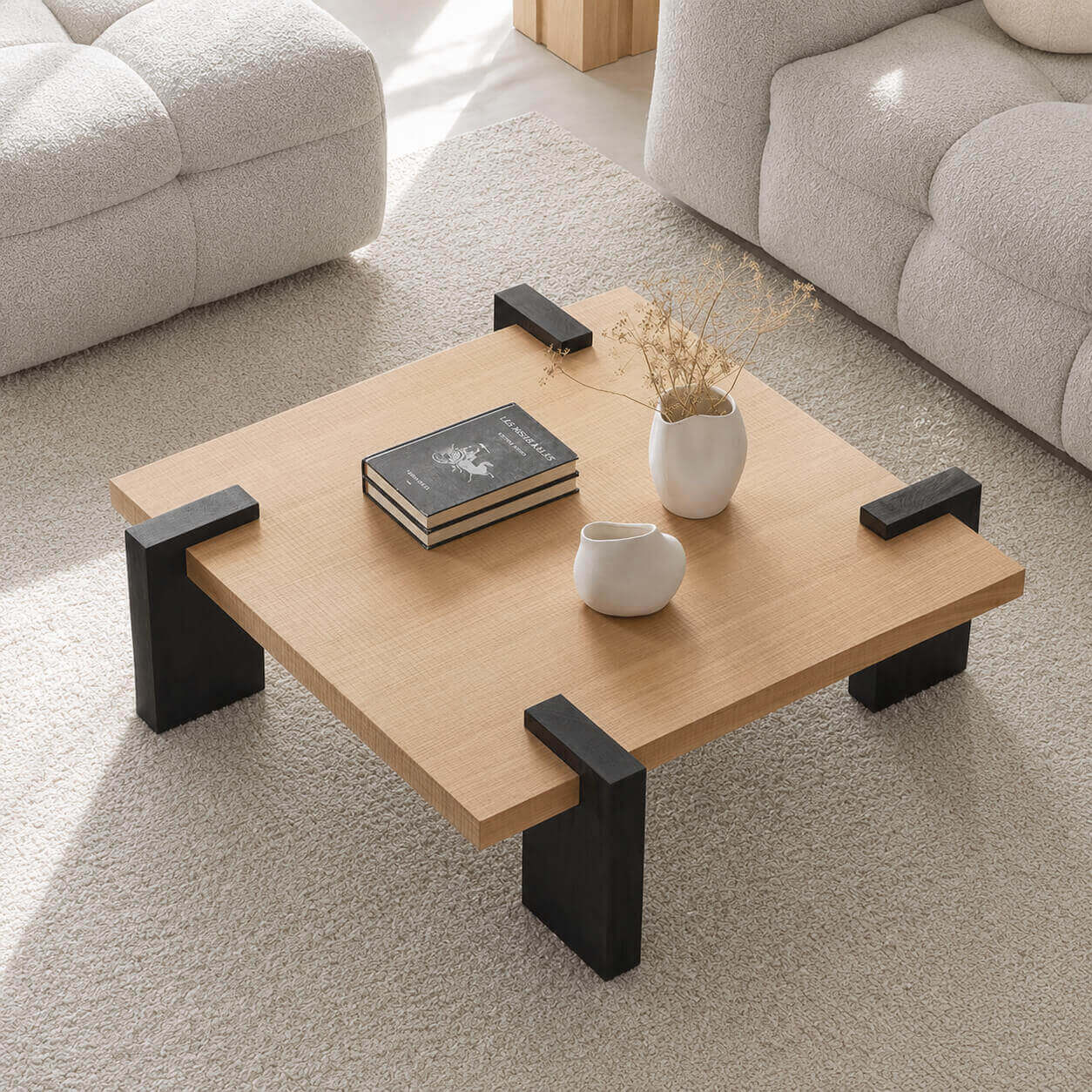 Anya Coffee Table with architectural wrap-around solid oak legs in a modern living room