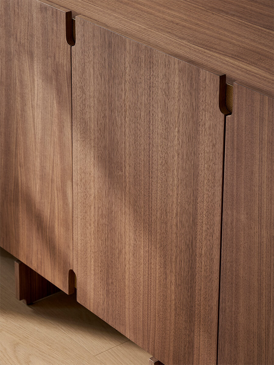 Close-up of walnut veneer grain on Arden sideboard