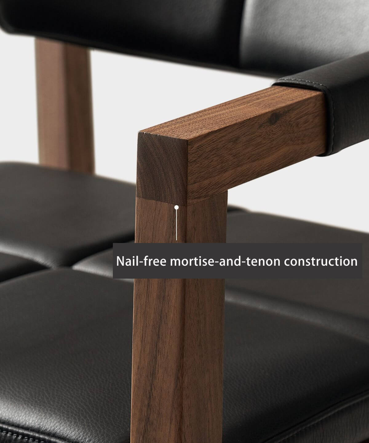 Solid walnut armrest detail on Arden dining chair
