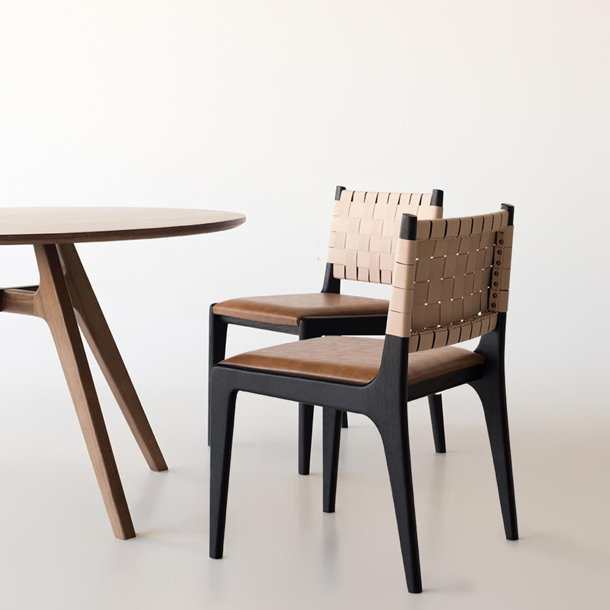 Arthur dining chair beside timber dining table