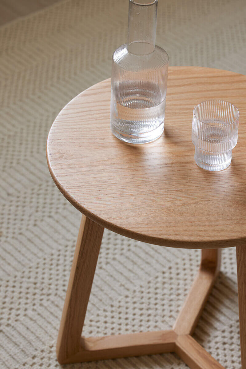 Close-up of the Aspen Solid Oak Side Table with a mug and glass