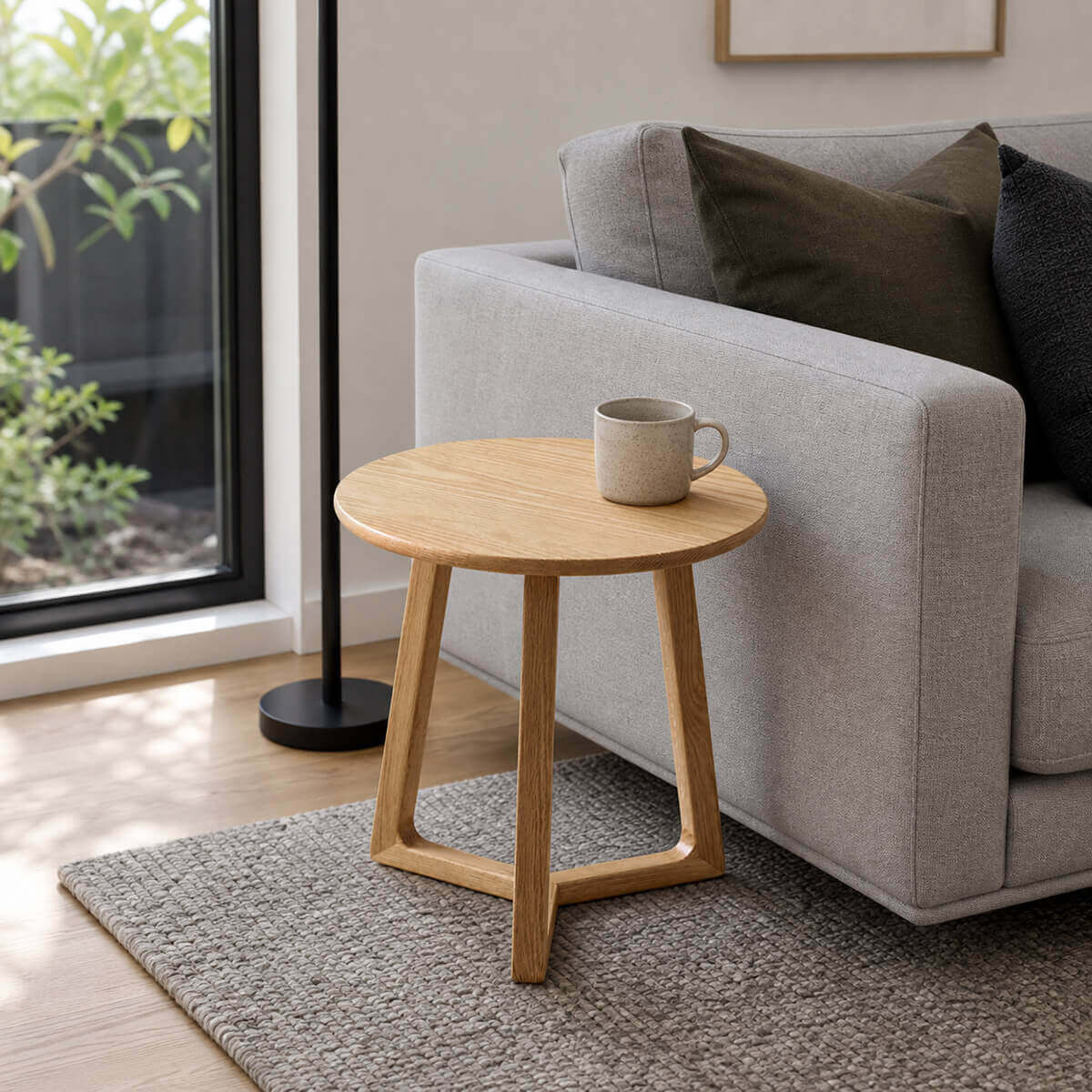 Aspen Solid Oak Side Table beside a sofa in a modern living room