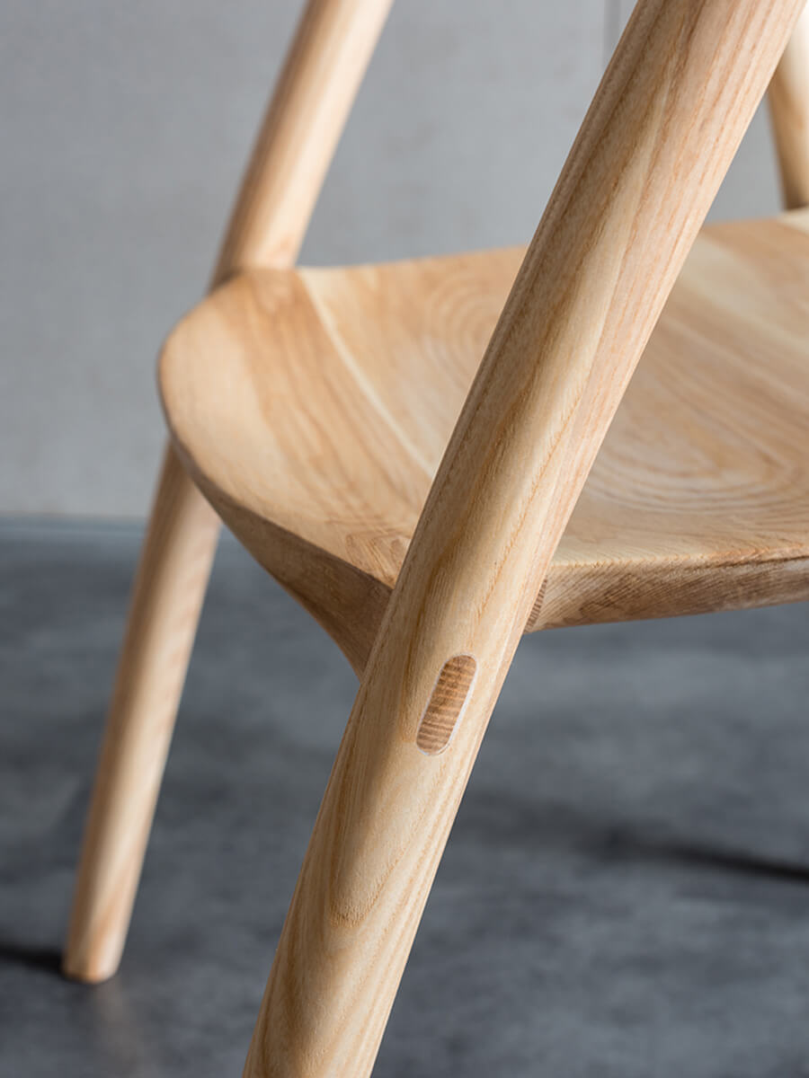 Close-up of Bata dining chair seamless timber joinery detail