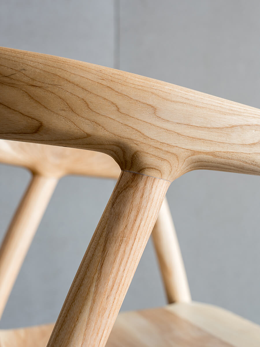 Close-up of Bata dining chair solid ash wood grain