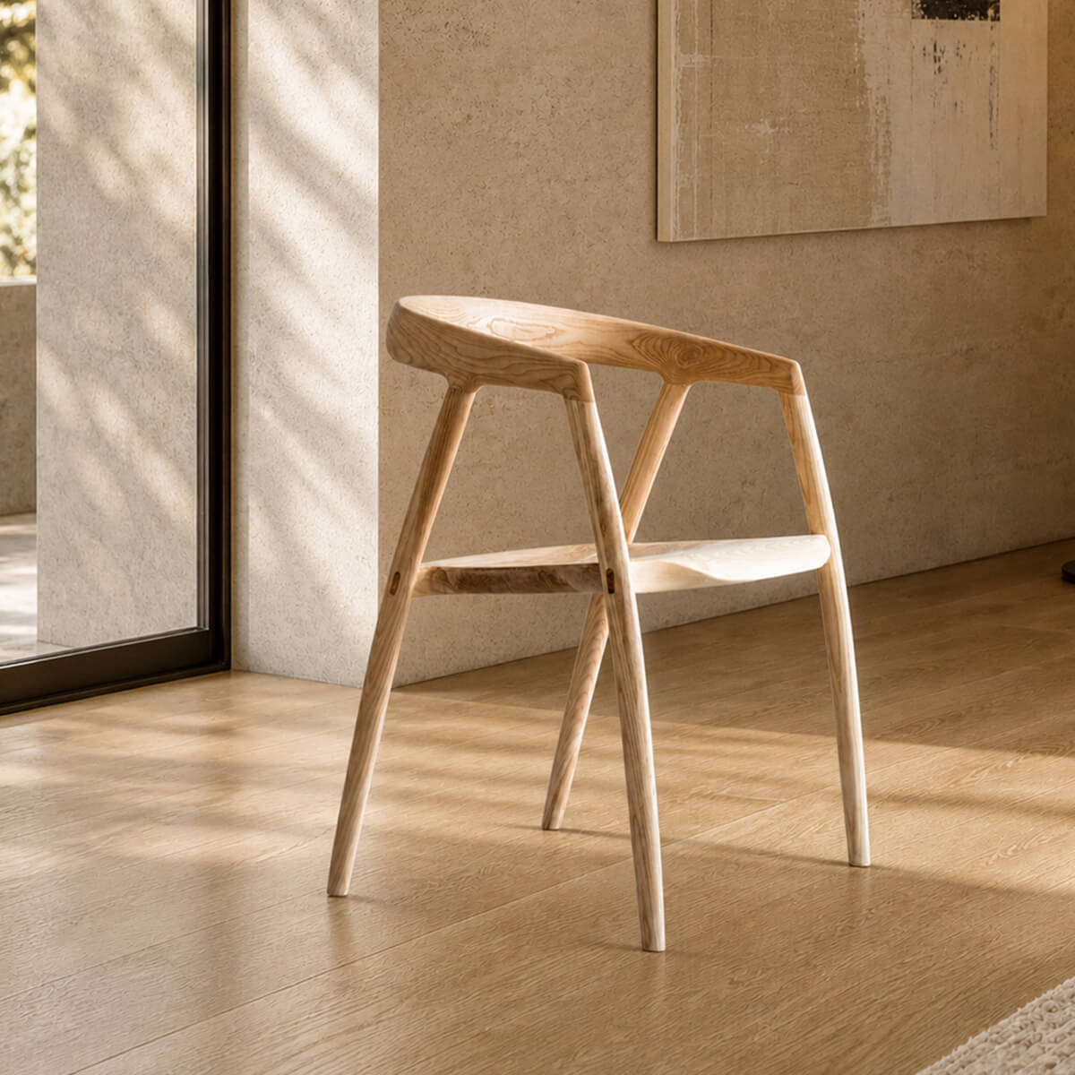 Bata solid ash dining chair in a quiet luxury interior with natural travertine walls and European oak flooring