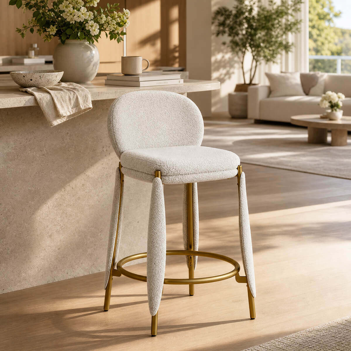 Belle Bar Stool with cream upholstery and gold frame in modern kitchen