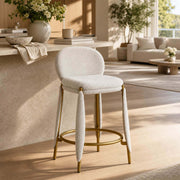 Belle Bar Stool with cream upholstery and gold frame in modern kitchen