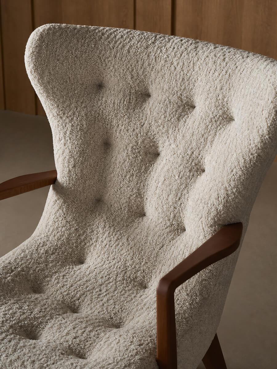 Button-tufted high backrest detail of the Berkeley Armchair
