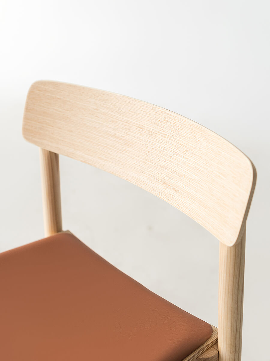 Close-up of Betty dining chair curved backrest detail