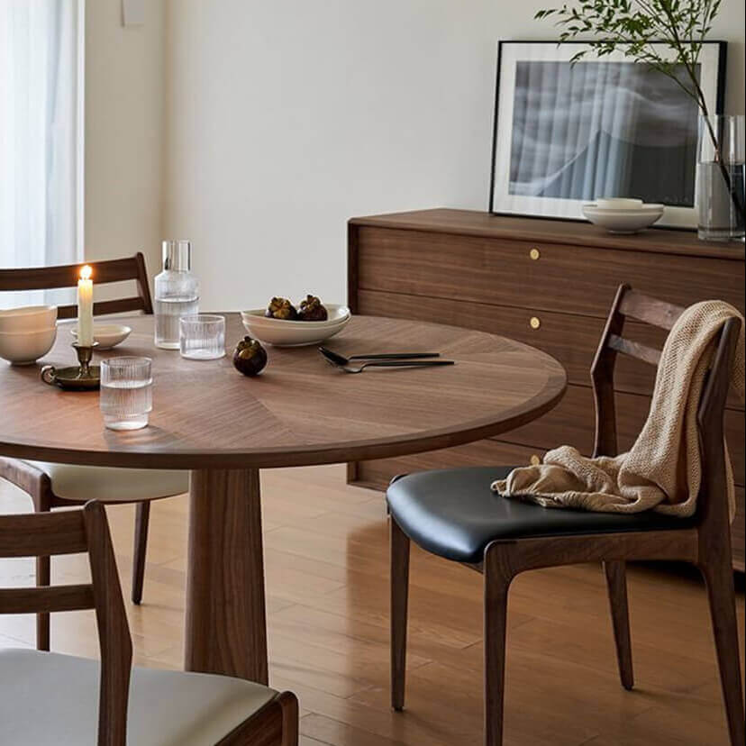 Cambell round dining table in walnut finish styled in a modern dining room