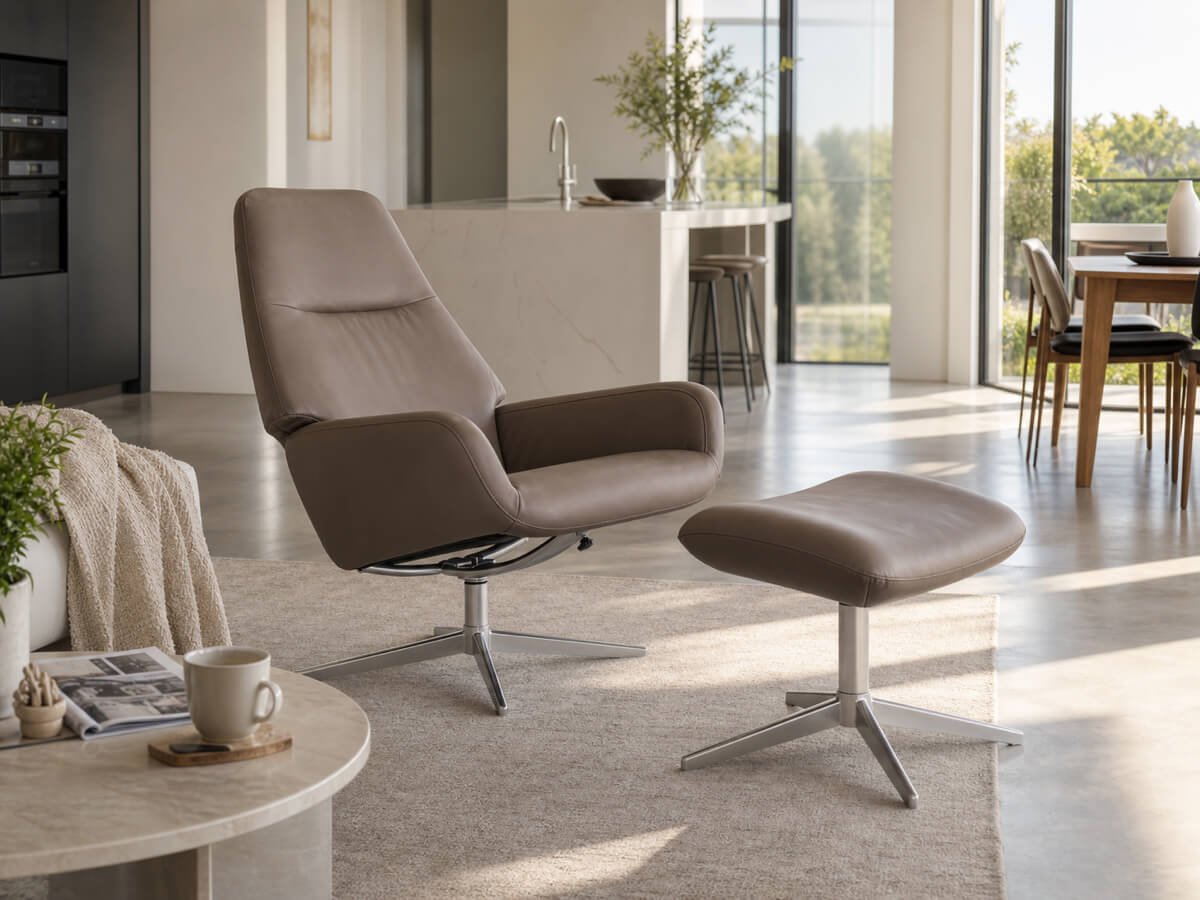 Light grey Camillo recliner chair and footstool in a spacious sunlit living space