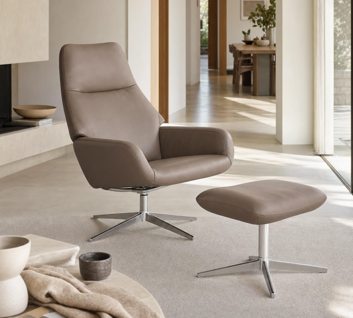 Camillo Swivel Recliner Chair and footstool in light grey leather in a contemporary interior