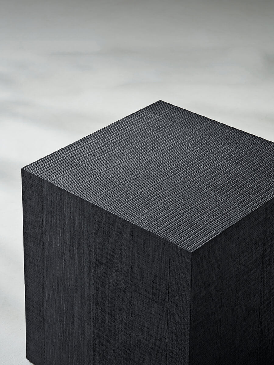 Close-up of the Clara Cube Side Table in black finish showing the tabletop texture.