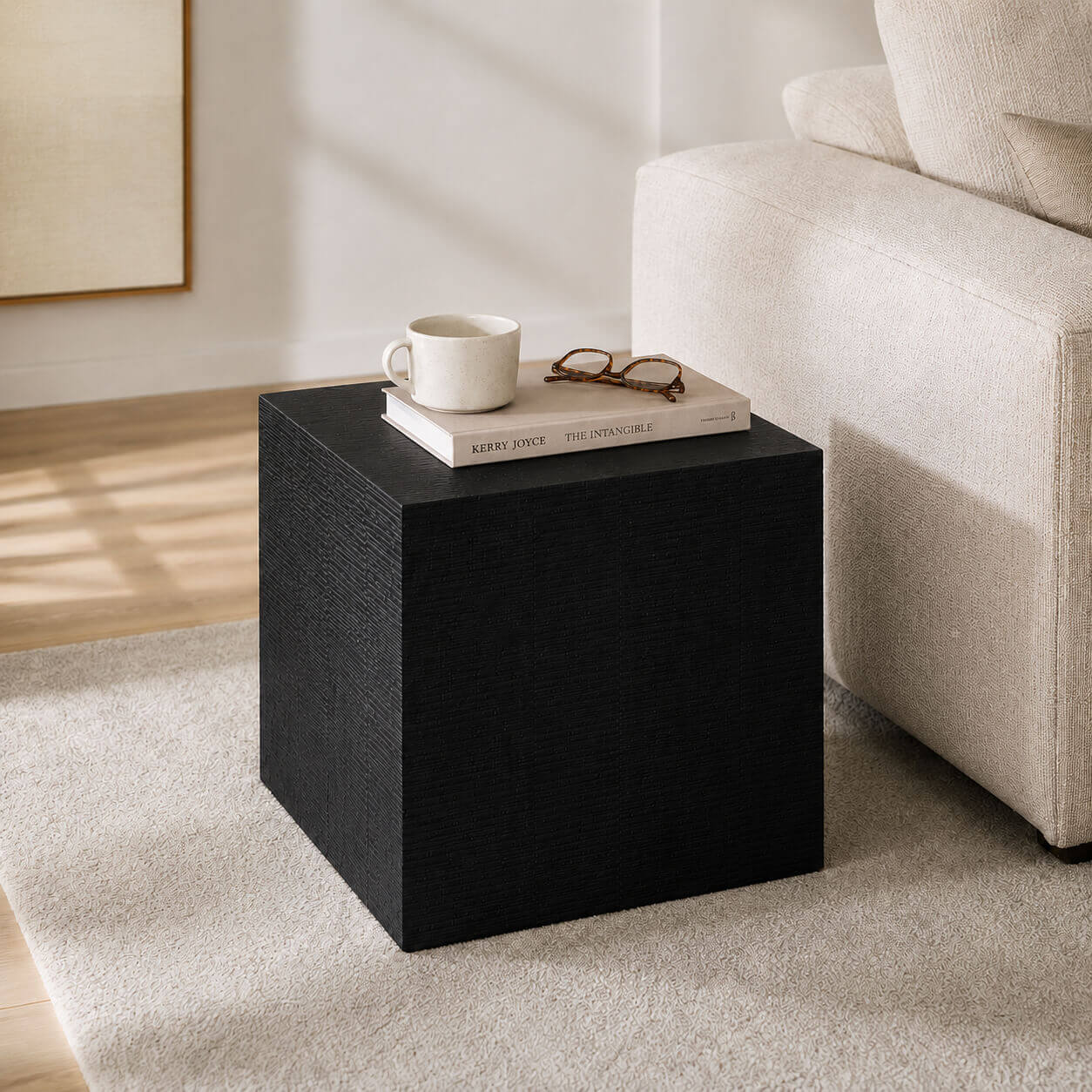 clara cube side table black in living space