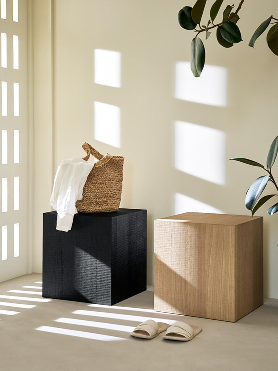 Clara Cube Side Table available in oak and black finishes in hallway.