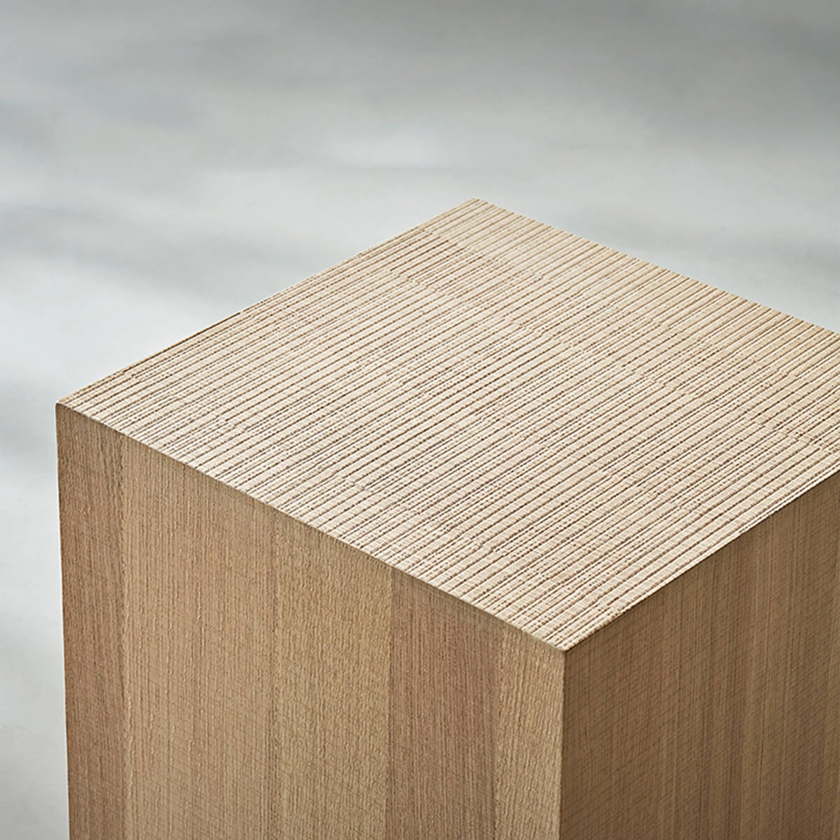 Close-up of the Clara Cube Side Table in oak finish showing the tabletop texture.