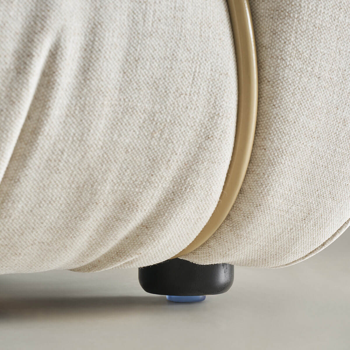 Detail of the Cloudscape Armchair base and upholstery finish