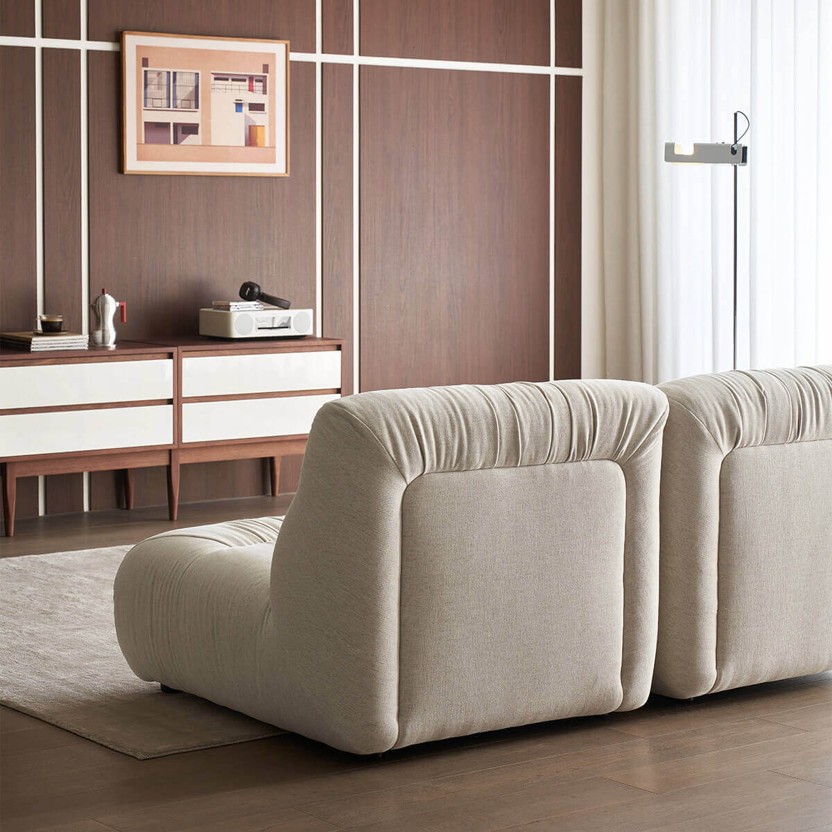 Rear view of the Cloudscape Armchair in cream fabric upholstery