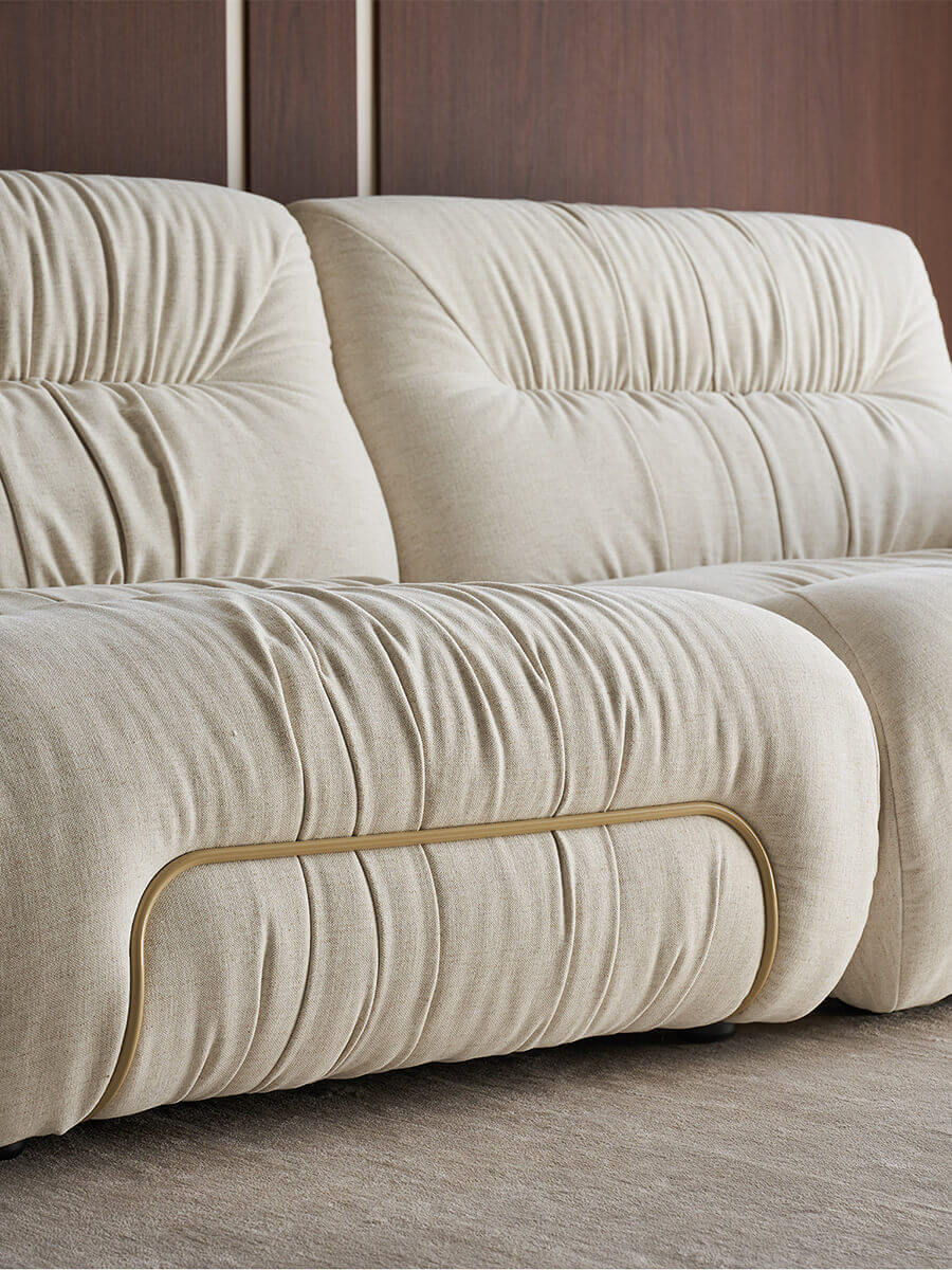 Front detail of the Cloudscape Armchair in cream fabric upholstery