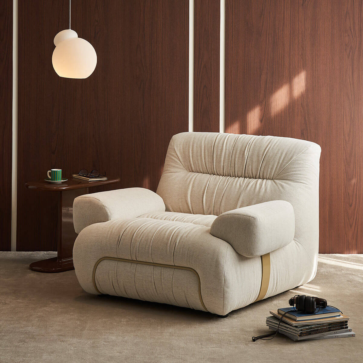 Cloudscape Armchair in cream fabric upholstery styled in a contemporary living room