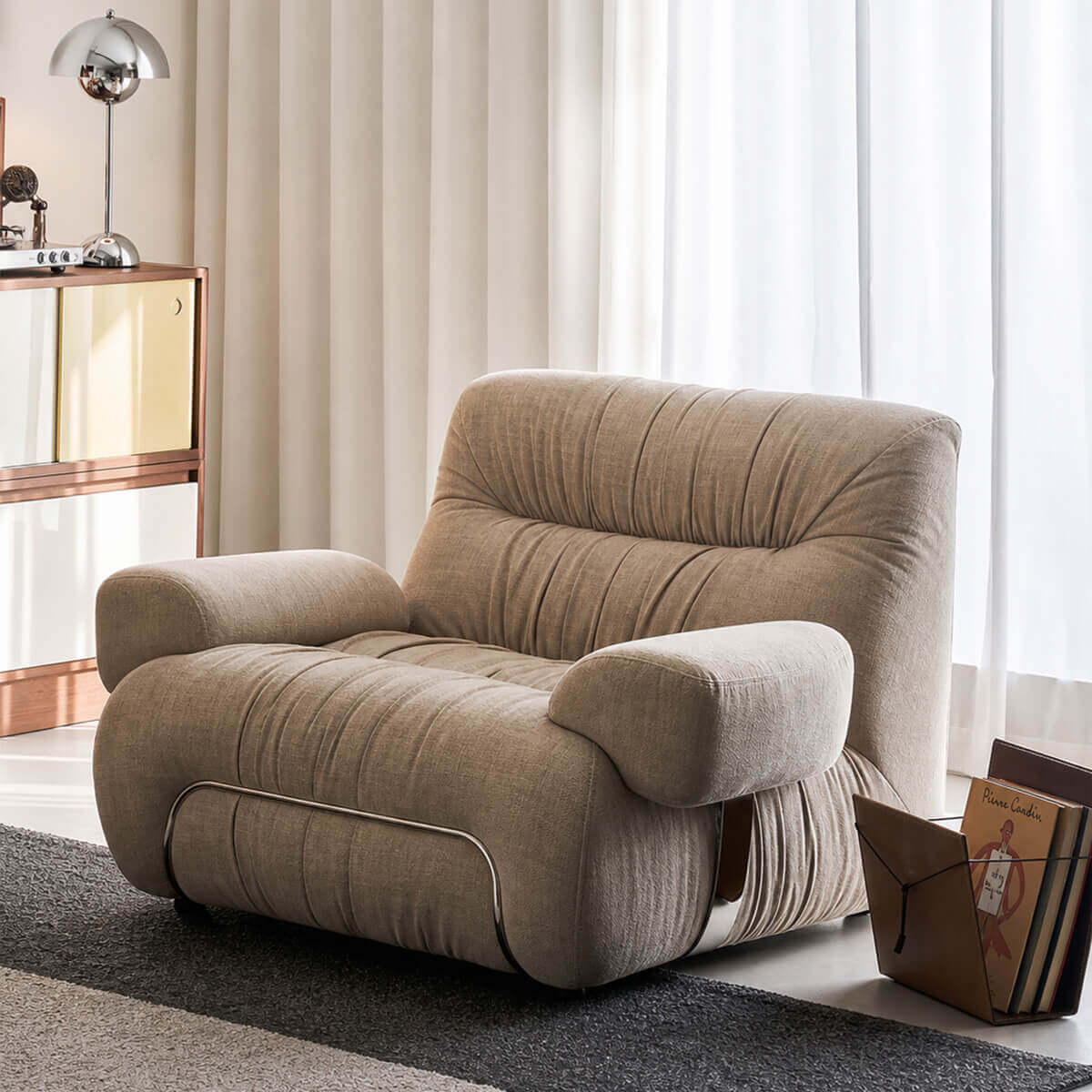 Cloudscape Armchair in cream fabric upholstery styled in a reading corner