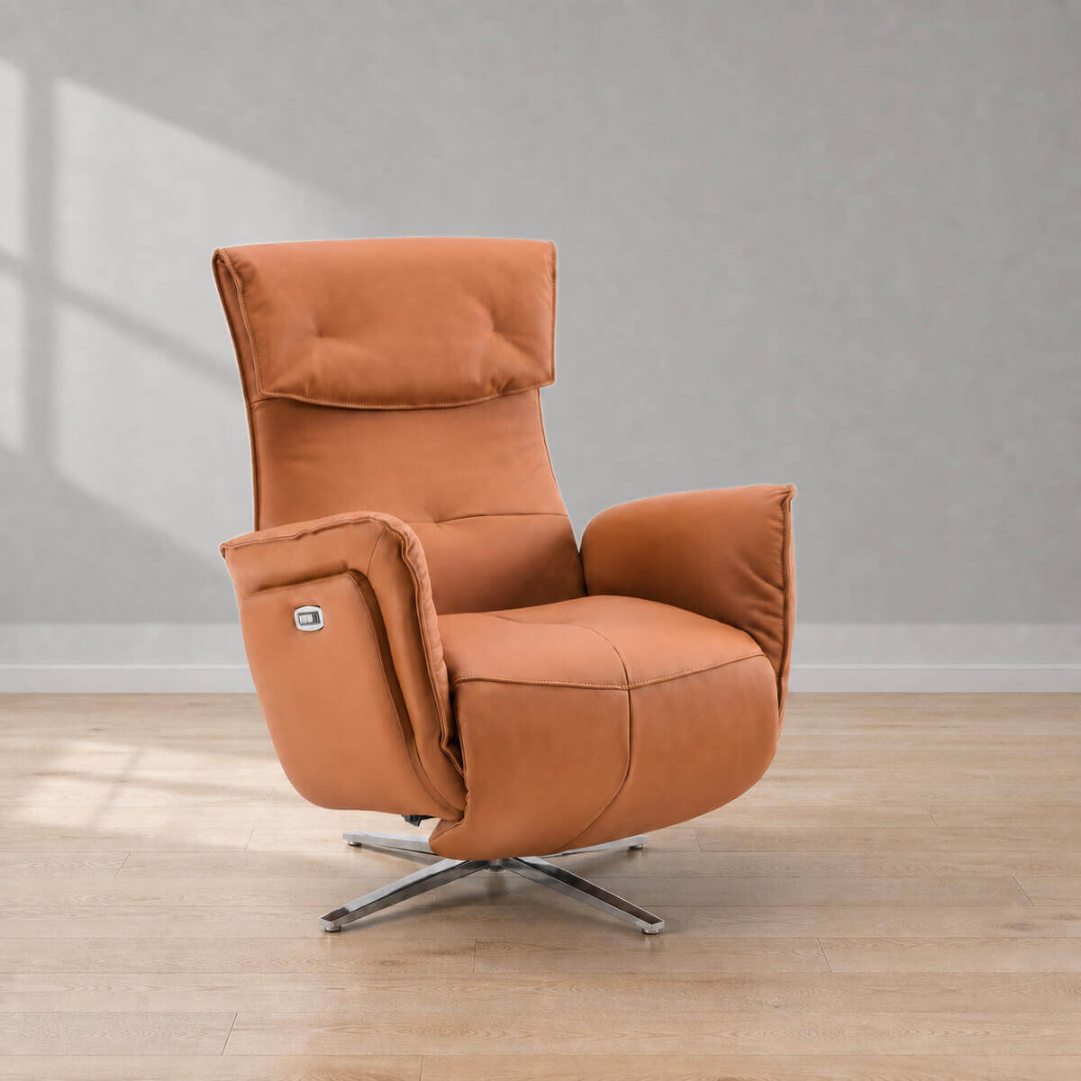 Copenhagen electric recliner chair in tan leather with swivel base in a minimalist living room setting