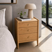 Denmark Solid Oak Bedside Table in a modern bedroom with natural light