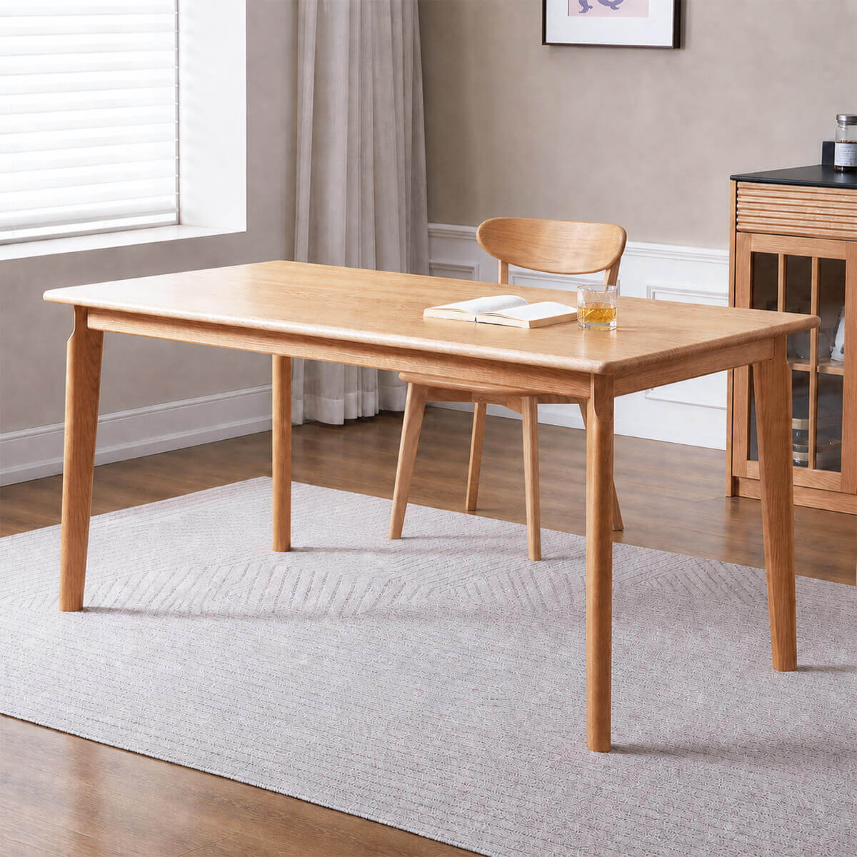 Denmark solid oak dining table in natural oak finish styled in a Scandinavian dining room