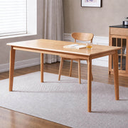 Denmark solid oak dining table in natural oak finish styled in a Scandinavian dining room