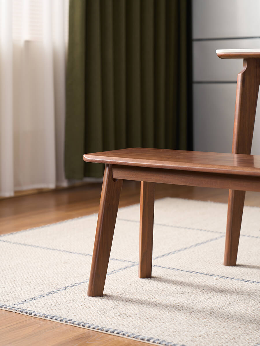 Denmark solid walnut bench side view showing angled legs