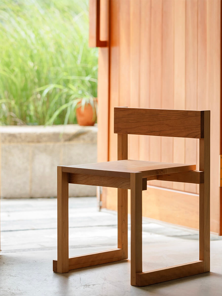 Edge Solid Cherry Dining Chair in a minimalist interior