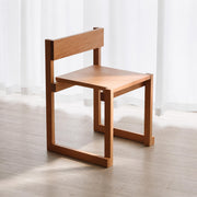 Edge Solid Cherry Dining Chair in a bright modern dining room