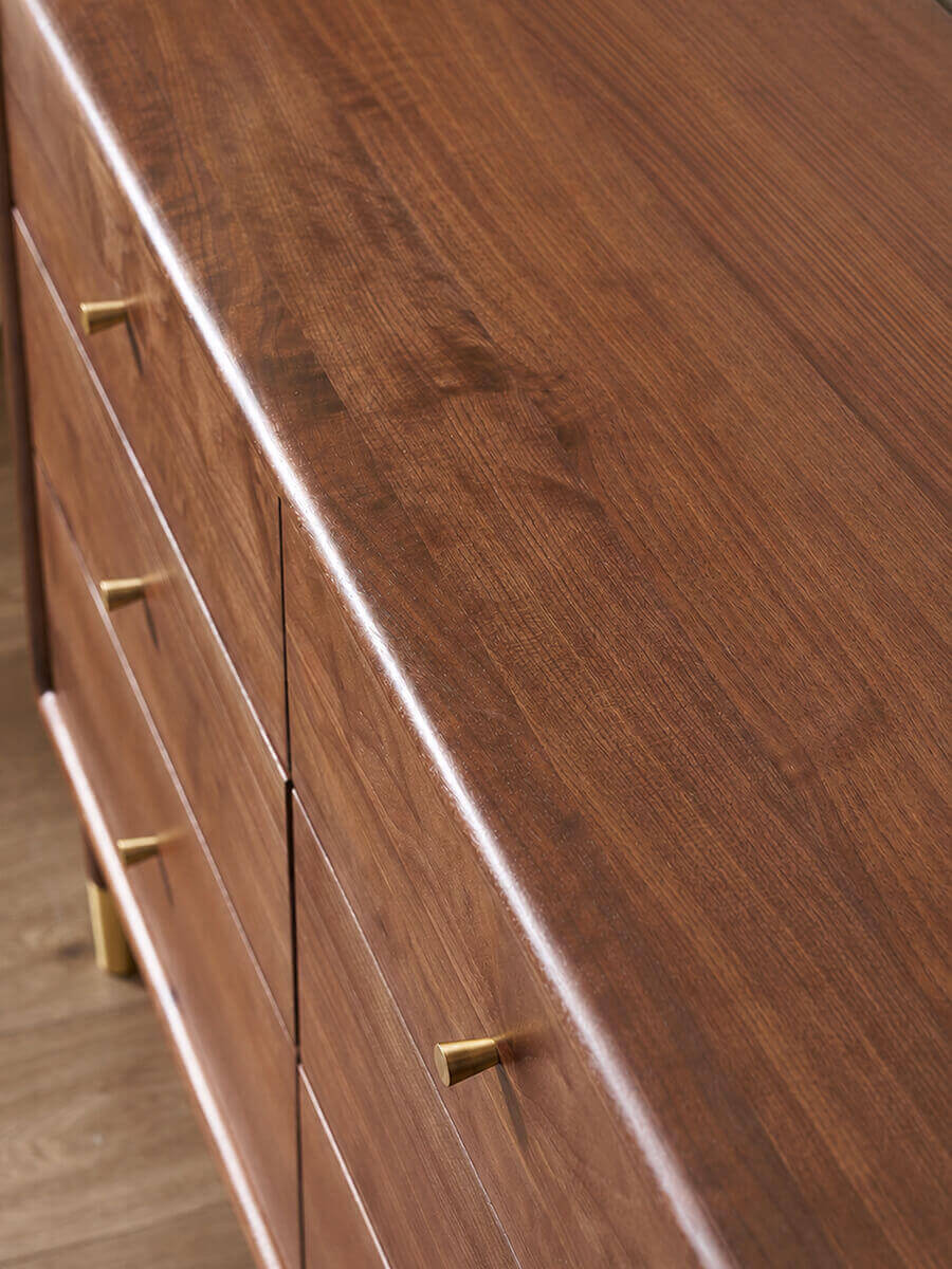 Close-up of the solid North American walnut grain on the Elara Chest of Drawers