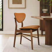 Ellyn solid ash dining chair with floating backrest in a contemporary dining room