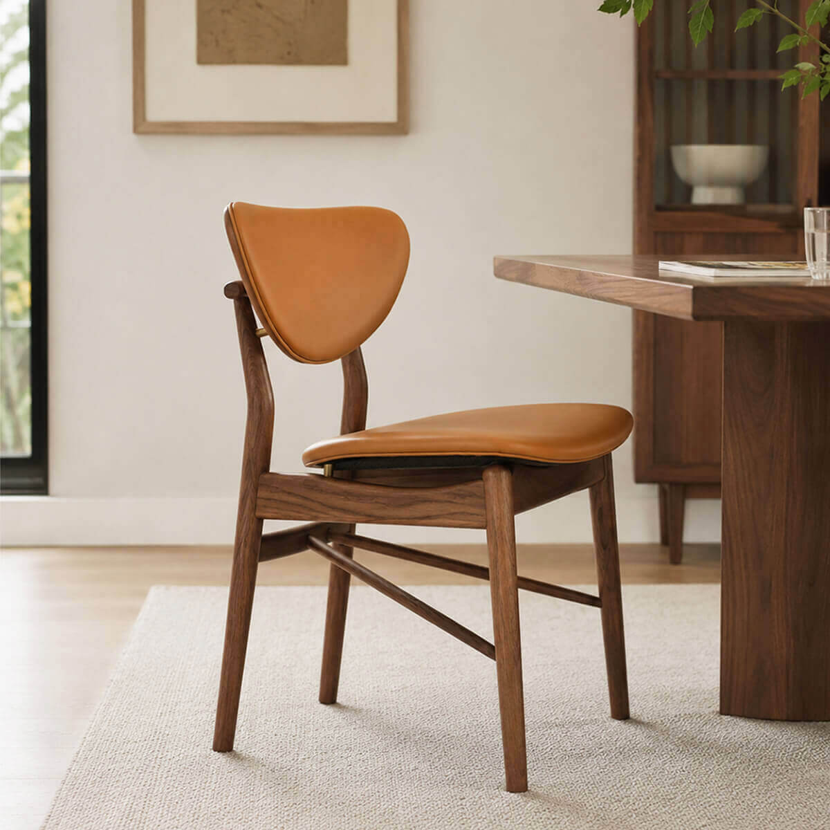 Ellyn solid ash dining chair with floating backrest in a contemporary dining room