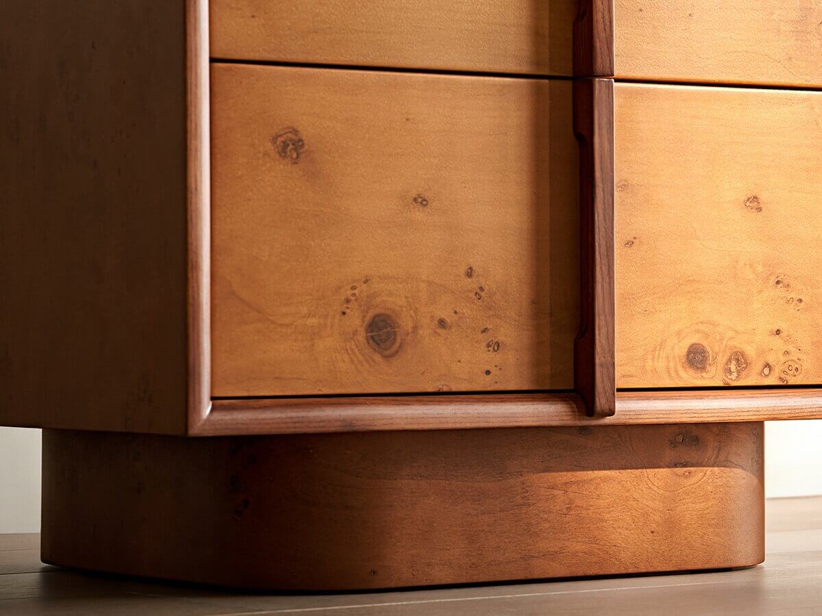 Natural burl veneer detail on the Elmora bedside table