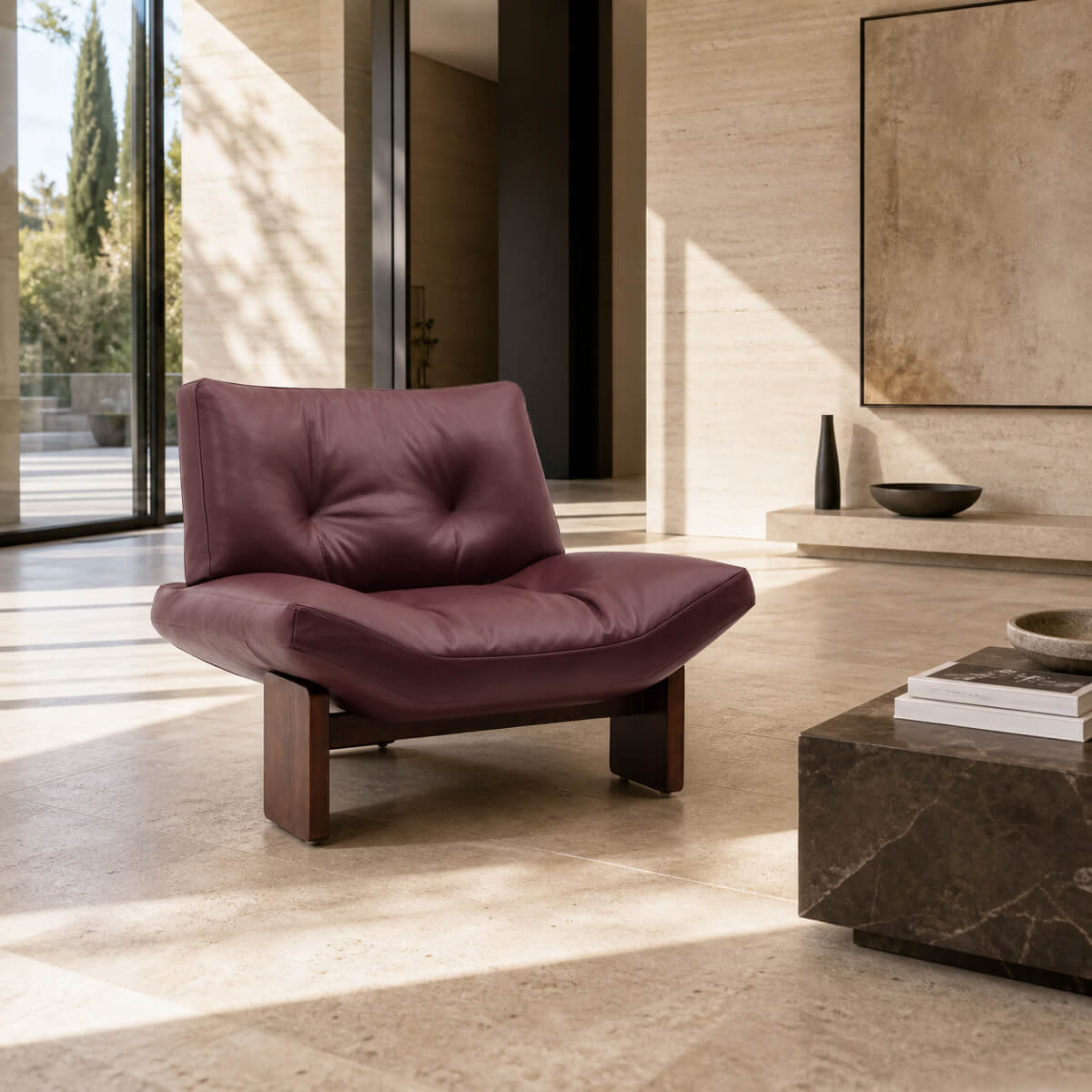 Emmi Armchair Replica upholstered in full grain leather with sculptural timber bas