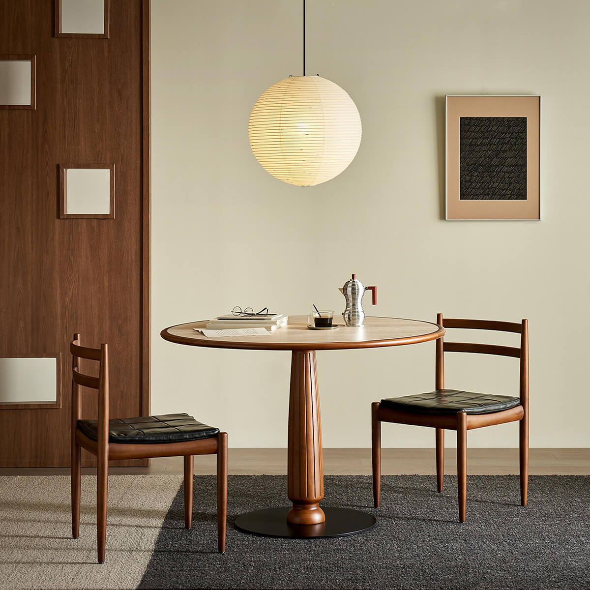 Evanston round dining table styled in a modern dining room