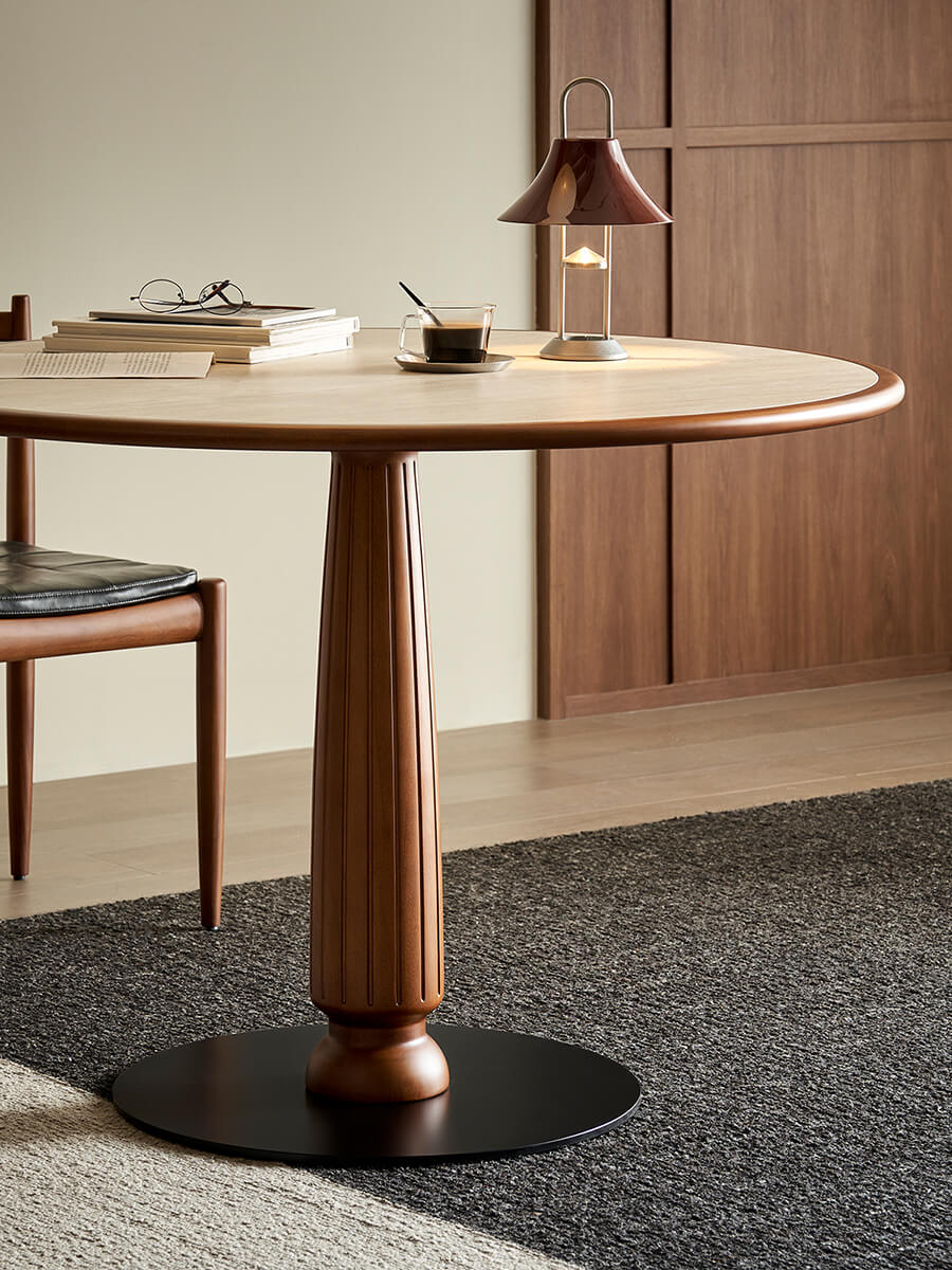 Close-up of Evanston round white-sintered-stone dining table tabletop