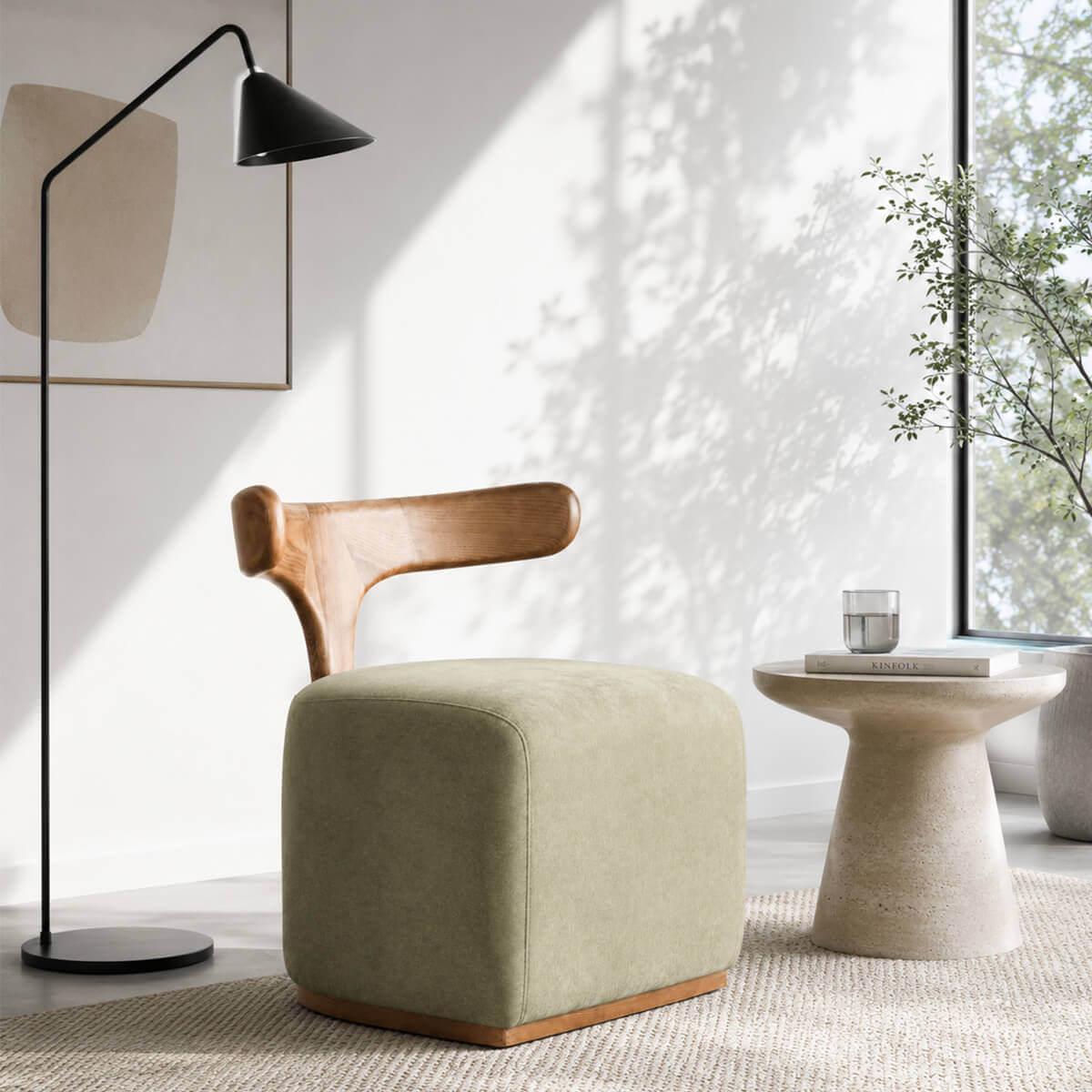 Falun designer stool with solid American ash frame in a contemporary living room reading corner