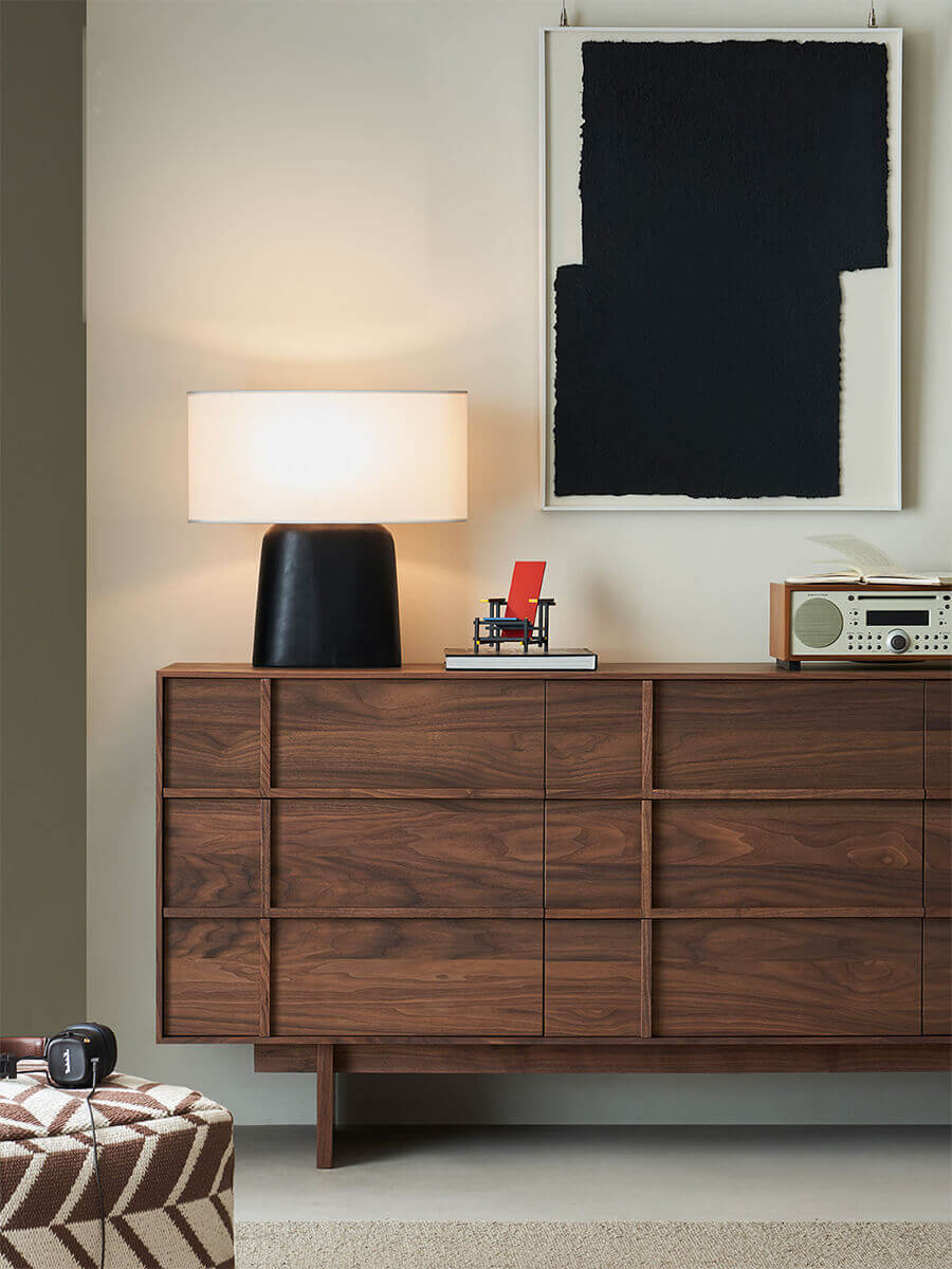 Field Chest of 9 Drawers in walnut finish styled in a contemporary livingroom