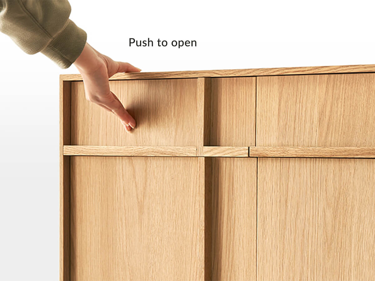 Push to open door mechanism on the Field Sideboard