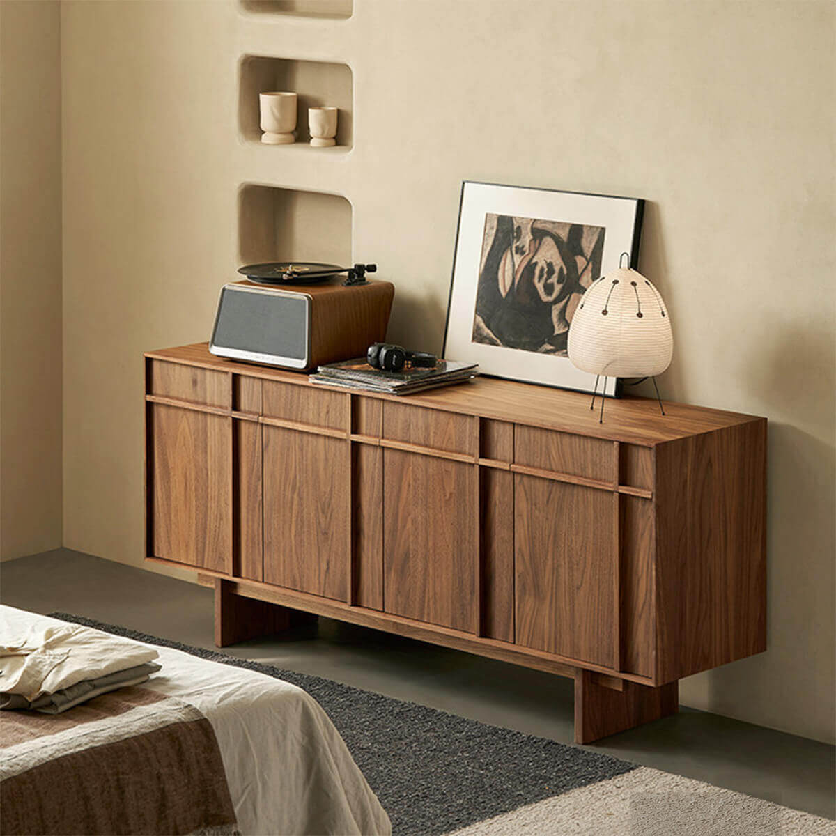 Field Sideboard walnut finish styled in a bedroom