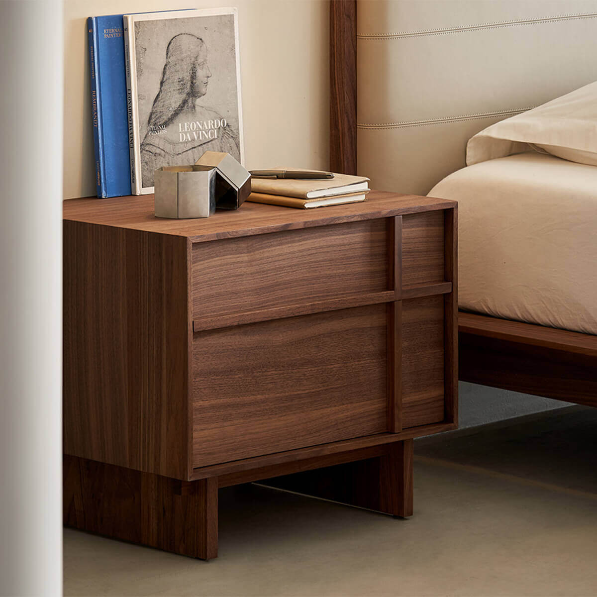 field walnut bedside table styled in a contemporary bedroom