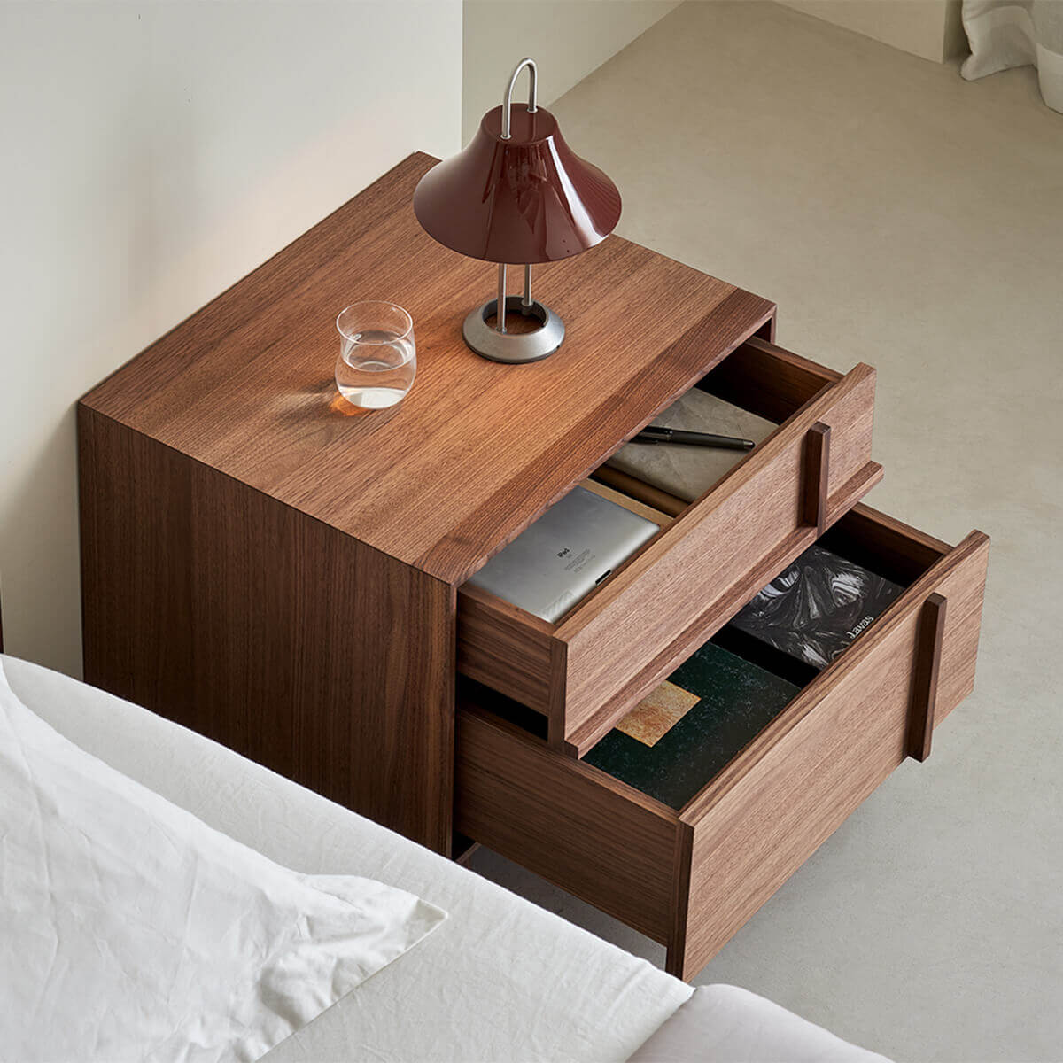 Open drawers showing storage inside the field walnut bedside table