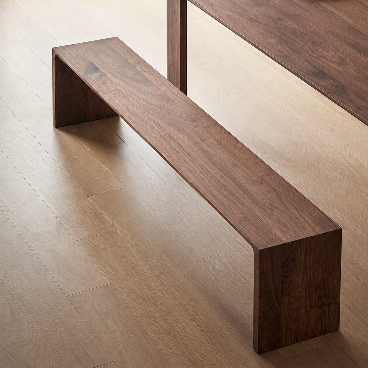 Flemington solid walnut bench close-up showing continuous wood grain