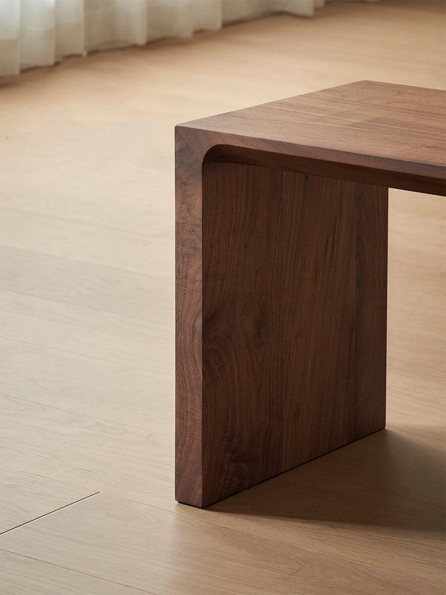 Close-up of the Flemington solid walnut bench end panel